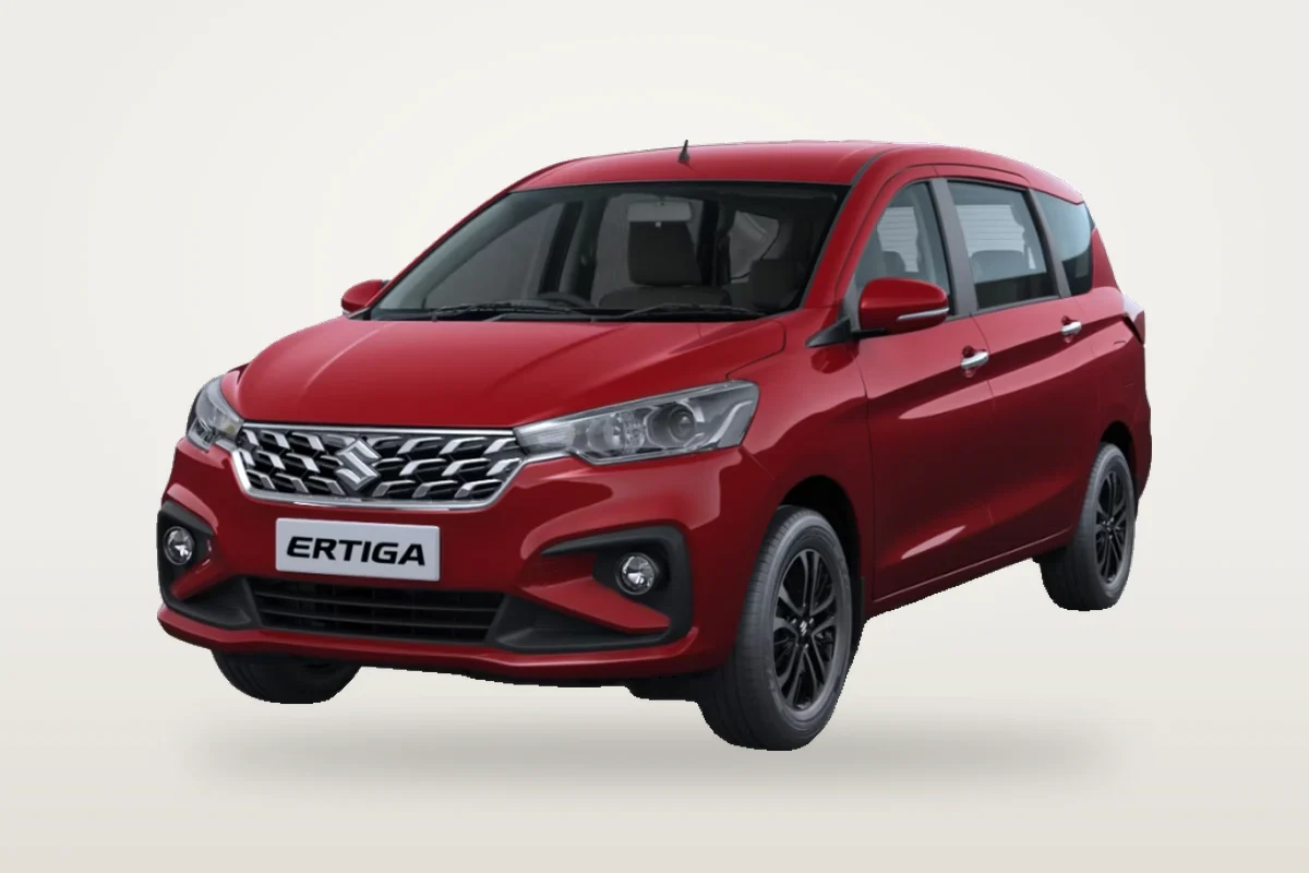 Red Maruti Suzuki Ertiga, front three-quarter view