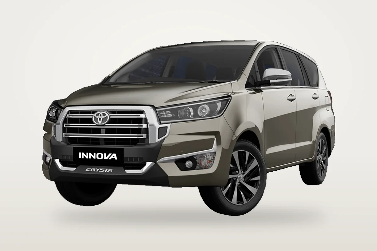 Bronze Toyota Innova Crysta, front three-quarter view